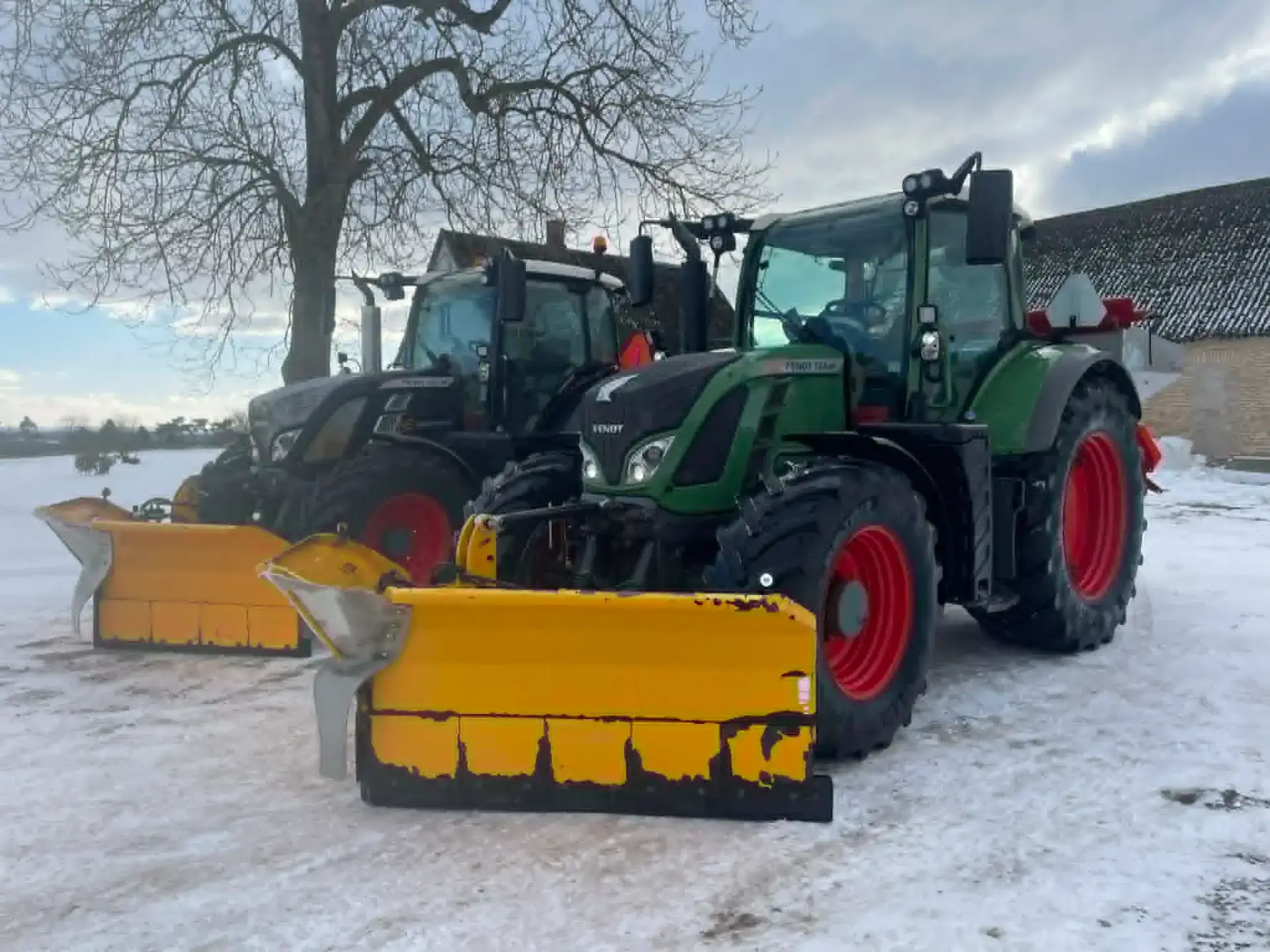 To store with snow-covered ground and tractors in Denmark.